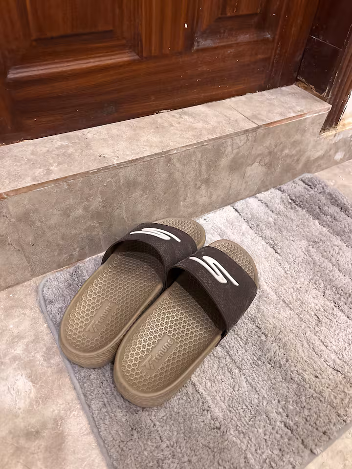 Bathroom slippers near step